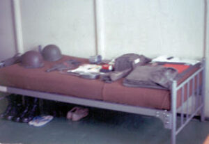 Army rack laid out for a field gear inspection 